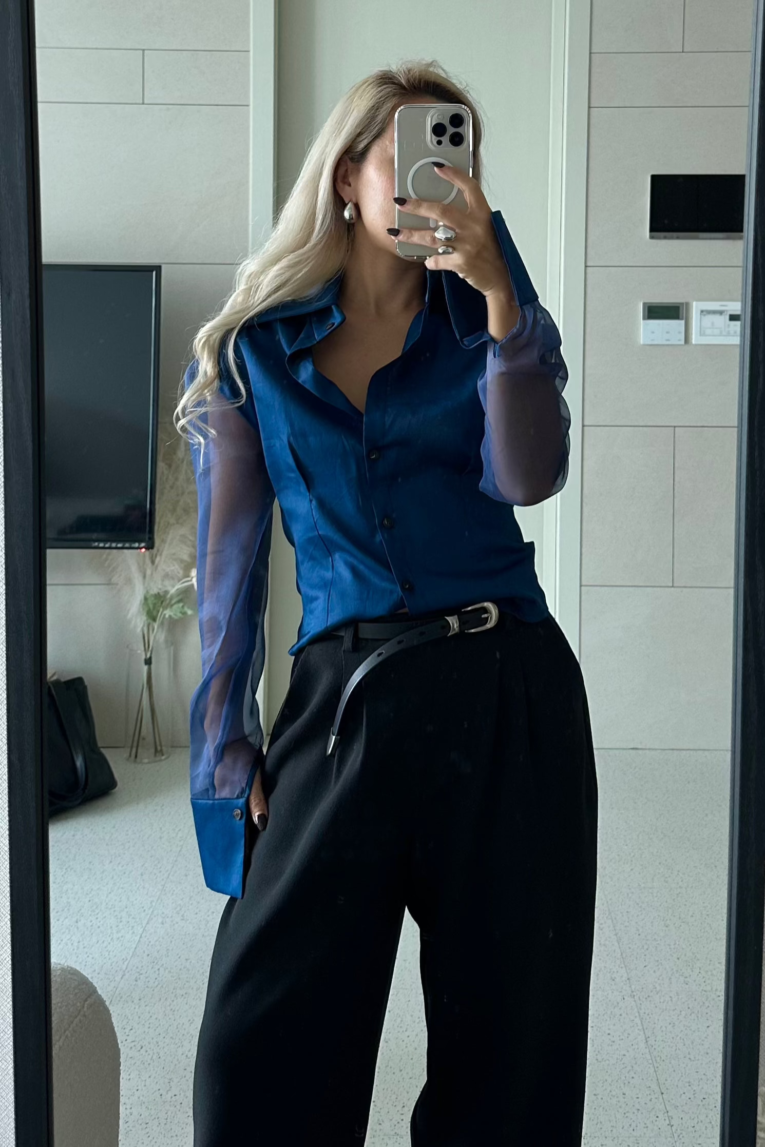 Royal navy blue button down shirt with silk organza sheer sleeves. Styled buttoned up with black pants. Perfect for the office or summer outings.