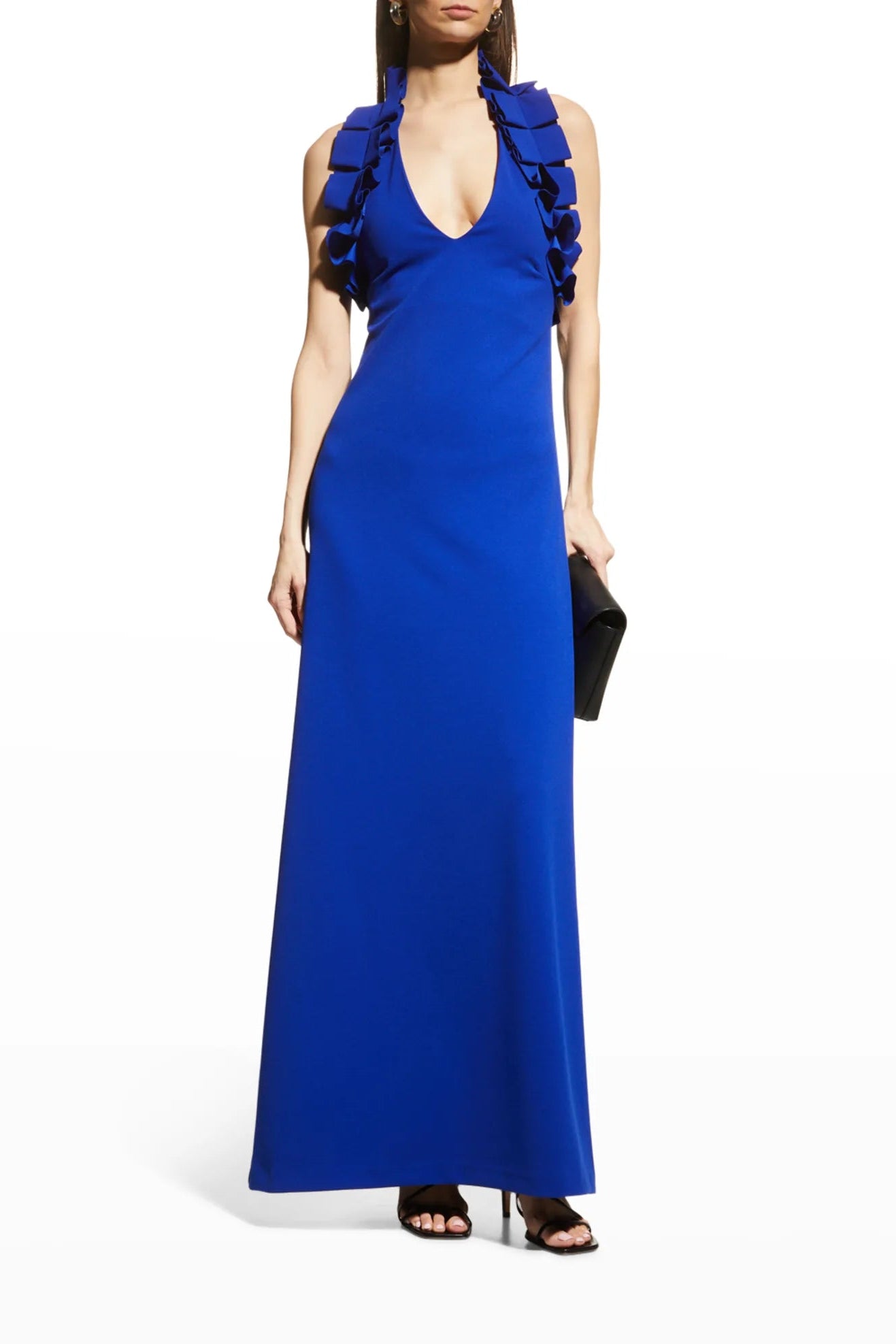 Woman in royal blue v-neck maxi dress with ruffle detail along the sleeve. Perfect for events.